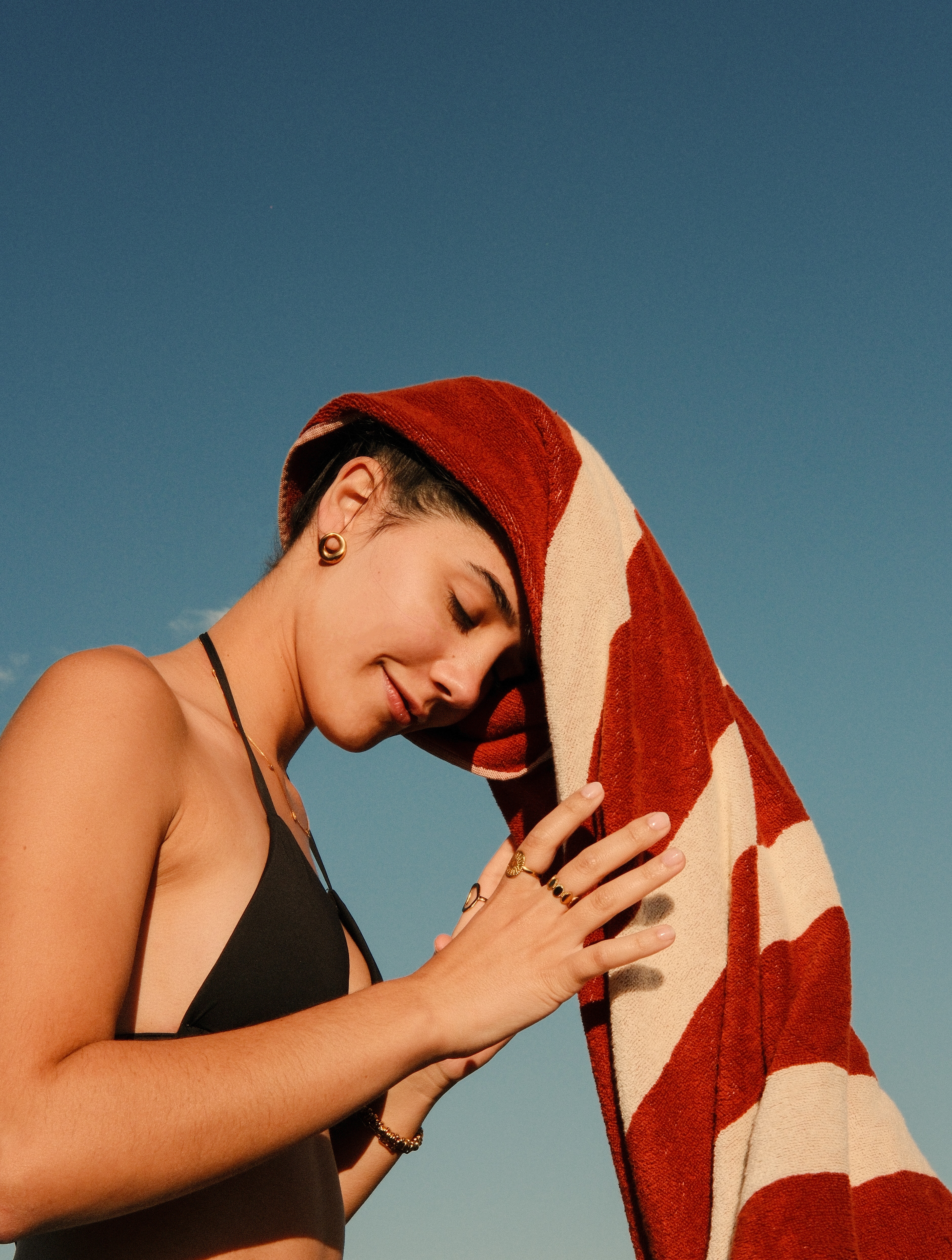 brasa terracotta towel worn as head wrap